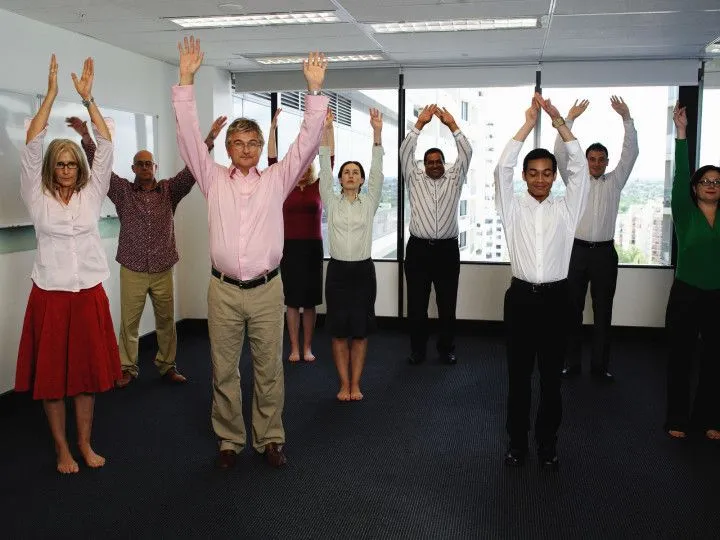 Team members gathered for a group wellness session